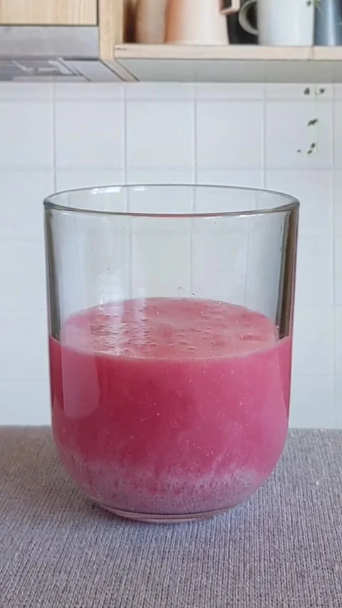 Adding berry flavour soda into a glass of water. Preparing a medicine vitamin Stock Footage 212340249