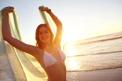 Adding a bit of beauty to the beach. an attractive young woman on the beach. Stock Photos