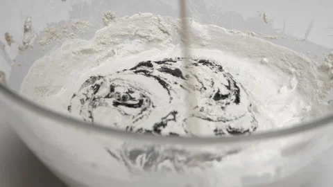 Adding black paint to concrete and stiring Video stock 186561526