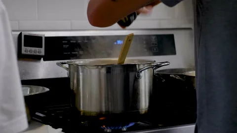 Adding Black Pepper From Grinder To Boiling Pot Soup Stock Footage 139232814
