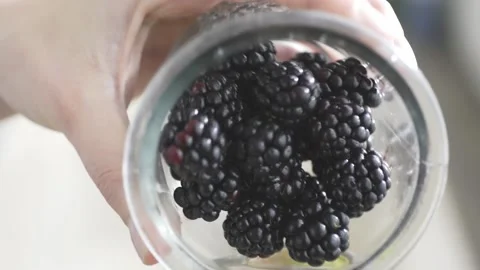 Adding blackberries Stock Footage 140268538