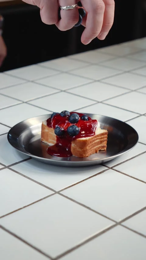 Adding Blueberries to Cheesecake Dessert Stock Footage 342924321