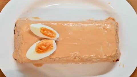 Adding a boiled egg to pudding Stock Footage 228222063