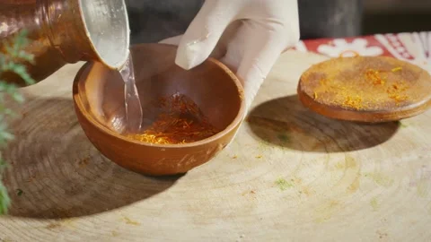 Adding boiling water to spices Stock Footage 138127629