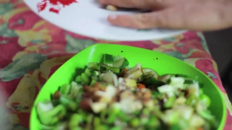 Adding brazil nuts and almonds to salad Stock Footage 35223503