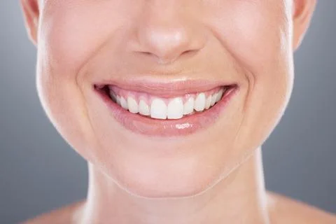 Adding a brighter look to her face. Studio shot of an unrecognisable woman Stock Photos