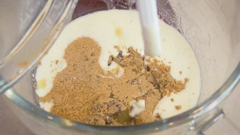 Adding Brown Butter to Cookie Dough in an Electric Stand Mixer - 4k Stock Footage 102527604