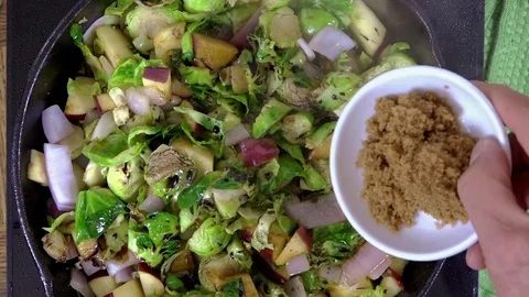 Adding brown sugar to a recipe Stock Footage