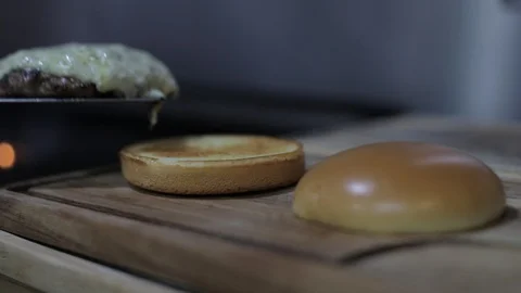 Adding Burger with Gorgonzola Cheese Sauce on Bread Stock Footage 128463419