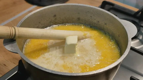 Adding butter to boiling lulesh Stock Footage 147651878