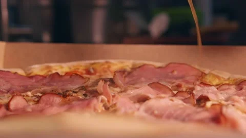 Adding butter to the finished pizza Stock Footage 158404031