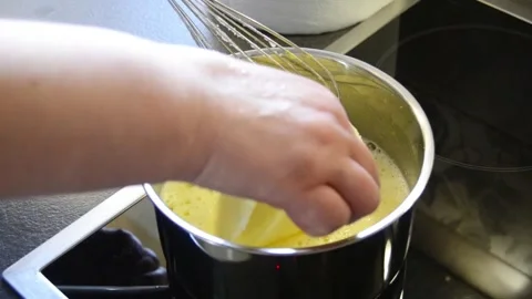 Adding butter to lemon curd during homemade preparation 스톡 동영상 344661398