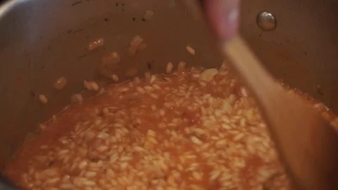 Adding butter to risotto Stock Footage 112127175