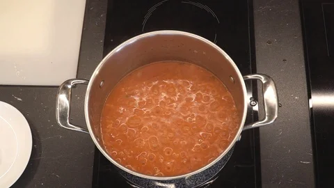 Adding butter to risotto overhead Stock Footage 112127876