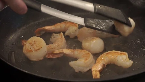 Adding butter to seafood Stock Footage 112127243