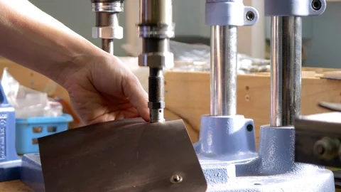 Adding button to leather, Button press machine Stock Footage 118135911