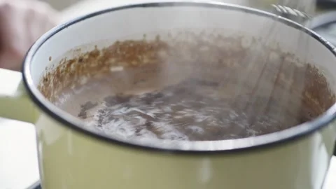 Adding cacao to hot chocolate Stock Footage 140268508