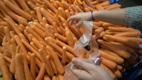 Adding Carrot to Nylon Pochette Stock Footage 106222052