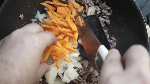 Adding carrots Stock Footage 97410730