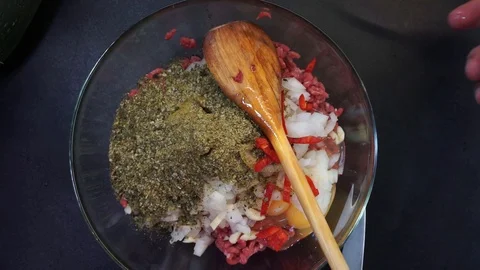 Adding cheese and spicing stuffing overhead Stock Footage 119780915