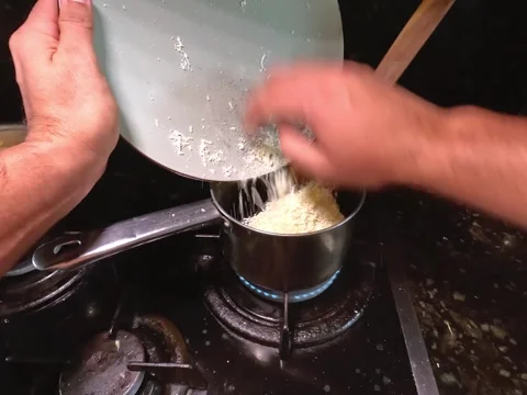 Adding cheese to cooked beans Stock Footage 319963739