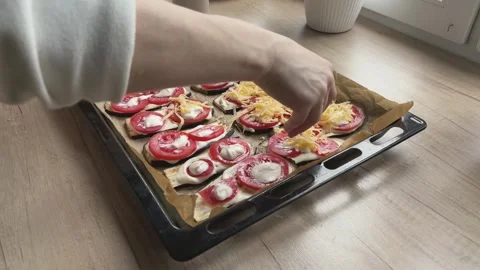 Adding Cheese To Eggplant Bake On Tray Preparing Homemade Dinner Oven Recipe Video stock 336438275