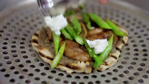 Adding cheese into a gyro Stock-Footage 307340104