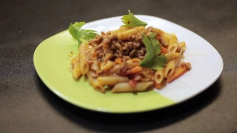 Adding cheese to pasta Stock Footage 97411244