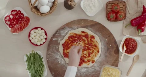Adding cheese on the raw dough Stock Footage 151202151