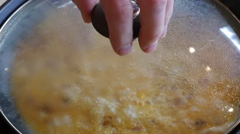 Adding cheese while making an omelette Stock Footage 49923794