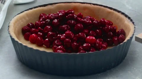 Adding Cherries to Pie Baking Cooking Hand Close Up  Vídeo Stock 147668369