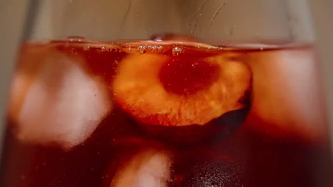Adding a Cherry Half to a Cocktail Glass, Macro. Stock Footage 279531905