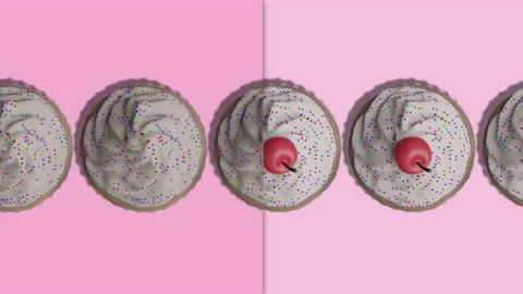 Adding cherryes to birthday cupcakes conveyor animation on pink background Stock Footage 197422209