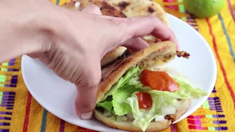 Adding chili sauce to gorditas de chicharron food in Mexico city Stock Footage 152247633