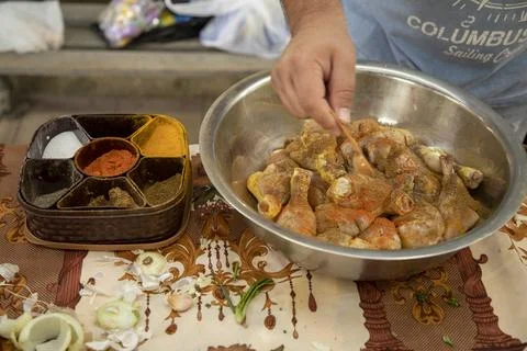 Adding chilli to the chicken Stock-Fotos