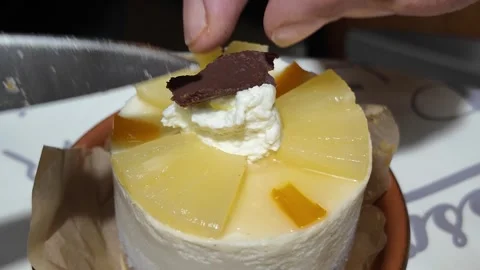 Adding chocolate decoration to homemade mini cake Stock Footage 345836204