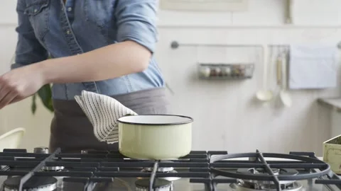 Adding chocolate in kitchen Stock Footage 140268423