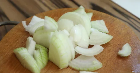 Adding chopped onions to a fresh vegetable salad Video stock 133829807
