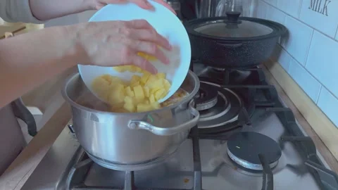 Adding Chopped Potatoes Into Soup Cooking Process Homemade Meal Vídeos de archivo 336456416