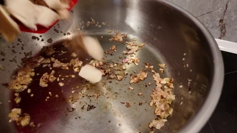 Adding chopped shiitake mushrooms to frying pan Stock-Footage 347011804
