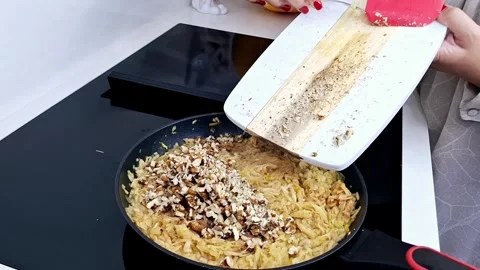 Adding Chopped Walnuts to Apple Filling for Homemade Pastry 4K 스톡 동영상 333371080