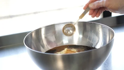 Adding cinnamon for granola Stock Footage 101733924