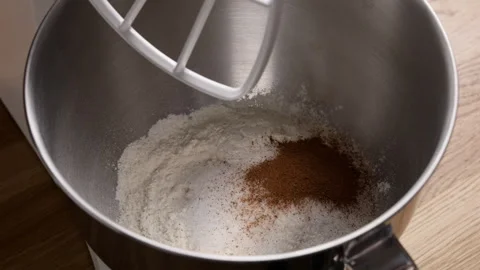 Adding Cinnamon To Stand Mixer Bowl Close Up Видео 332840564