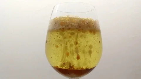 Adding Citric Acid &amp; Sodium Bicarbonate To Emulsion Of Oil, Water &amp; Coloring Stock Footage 83007724