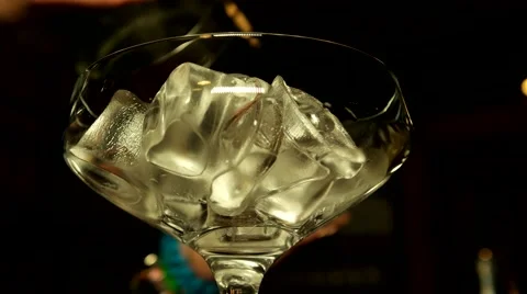 Adding cocktail to the glass with ice Stock Footage 65366811