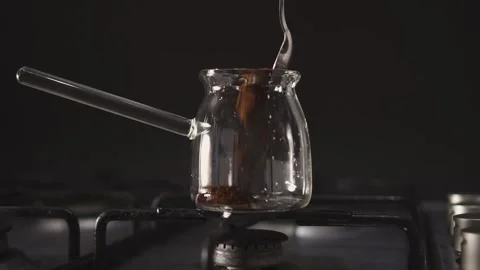 Adding coffee to a glass jug Stock Footage 168750854