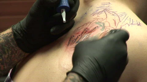 Adding color to a tattoo Stock Footage 120991