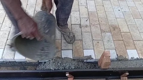 Adding Concrete to Pave Edge Sri Lanka Stock Footage 339537009
