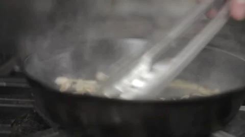 Adding condiments in cooking mushrooms Stock Footage 307340082