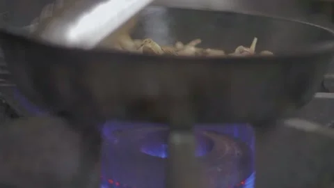 Adding condiments in cooking mushrooms Stock Footage 307340084